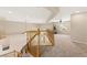 Bright loft area featuring neutral walls, plush carpeting, and a fitness machine near the sunlit window at 6013 Jubilee Gardens Ave, Las Vegas, NV 89131