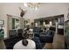 Bright living room features high ceilings, stylish furniture, a decorative chandelier, and an open layout at 606 Cadence Vista Dr, Henderson, NV 89011