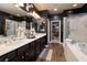 A luxury bathroom with double sinks, vanity space, and natural lighting at 606 Cadence Vista Dr, Henderson, NV 89011