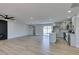 Open-concept living area with modern kitchen, fireplace and access to backyard at 6100 Fawn Cir, Las Vegas, NV 89107
