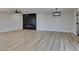 Living room with a modern fireplace, ceiling fan, and wood-look flooring throughout at 6100 Fawn Cir, Las Vegas, NV 89107