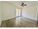 Bedroom featuring double doors and wood flooring at 6137 W Oakey Blvd # A, Las Vegas, NV 89146