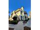 Charming multi-level condo building with a red tile roof and lush landscaping at 6137 W Oakey Blvd # A, Las Vegas, NV 89146