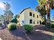 Two story stucco apartment complex with desert landscaping and palm trees with a red rock ground covering at 6137 W Oakey Blvd # A, Las Vegas, NV 89146