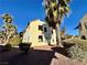 Exterior of a two-story condominium with desert landscaping under a clear blue sky at 6137 W Oakey Blvd # A, Las Vegas, NV 89146