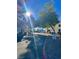 A street view of a residential community with mature trees and well-maintained landscaping on a sunny day at 6137 W Oakey Blvd # A, Las Vegas, NV 89146