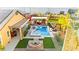 Aerial view showcases the backyard's full outdoor kitchen, pool, hot tub and fire pit, perfect for entertaining guests at 6980 W Meranto Ave, Las Vegas, NV 89178