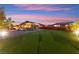 Spacious backyard with a pool, a fire pit, and a covered outdoor dining area at 6980 W Meranto Ave, Las Vegas, NV 89178