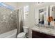 Cozy bathroom features granite counters, shower-tub combination, and modern fixtures offering a serene space at 6980 W Meranto Ave, Las Vegas, NV 89178