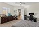 Comfortable bedroom offers a dresser, ceiling fan, plush carpet, and natural light creating a welcoming atmosphere at 6980 W Meranto Ave, Las Vegas, NV 89178