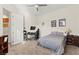 This bedroom boasts a ceiling fan, carpet, and makes a great workspace at 6980 W Meranto Ave, Las Vegas, NV 89178