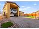 Spacious driveway with RV parking next to artificial turf putting green, blending recreation and practicality at 6980 W Meranto Ave, Las Vegas, NV 89178