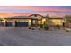 Beautiful single-story home with a three-car garage and well-manicured landscaping at 6980 W Meranto Ave, Las Vegas, NV 89178