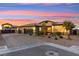 Spacious single-Gathering home with RV Garage featuring a well-maintained desert landscaped front yard and a three-car garage at 6980 W Meranto Ave, Las Vegas, NV 89178