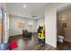 Open living room with wood floors and access to an ensuite bathroom with a glass-enclosed shower at 6980 W Meranto Ave, Las Vegas, NV 89178