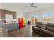 Open living room featuring hardwood floors, a kitchenette, and French doors leading to the outside at 6980 W Meranto Ave, Las Vegas, NV 89178