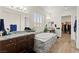 Bright main bathroom features double vanities with granite counters, soaking tub, plantation shutters and walk-in closet at 6980 W Meranto Ave, Las Vegas, NV 89178