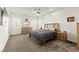 Spacious main bedroom boasts soft carpet, ceiling fan, shutters, and ample natural light throughout the space at 6980 W Meranto Ave, Las Vegas, NV 89178