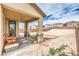Comfortable covered patio overlooking the spacious backyard, perfect for outdoor living at 7045 Judith River St, North Las Vegas, NV 89084