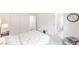 Spacious bedroom with neutral walls, carpet flooring, minimalist decor, and plenty of natural light at 7045 Judith River St, North Las Vegas, NV 89084