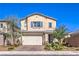 Charming two-story home with a well-manicured front yard and a two-car garage at 7045 Judith River St, North Las Vegas, NV 89084