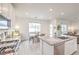 Kitchen with stainless steel appliances, countertops, island, and eating area at 7045 Judith River St, North Las Vegas, NV 89084