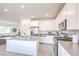 Kitchen with stainless steel appliances, grey countertops, and a kitchen island at 7045 Judith River St, North Las Vegas, NV 89084