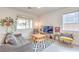 Bright living room featuring wood-look floors, and bright, natural light at 7045 Judith River St, North Las Vegas, NV 89084