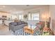 Cozy living room with open floorplan, wood-look floors and modern decor at 7045 Judith River St, North Las Vegas, NV 89084