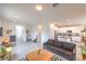 Open-concept living area and kitchen with modern decor, neutral tones, and abundant natural light at 7045 Judith River St, North Las Vegas, NV 89084