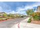 A tree lined street with beautiful homes, street lights, and sidewalks at 7045 Judith River St, North Las Vegas, NV 89084