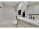 Bathroom with vanity, modern matte black fixtures, and tiled shower and tub combo at 71 Sea Holly Way, Henderson, NV 89074