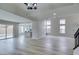 Bright, open living space with recessed lighting, hardwood floors and light gray walls at 71 Sea Holly Way, Henderson, NV 89074