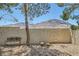 Well maintained backyard with desert landscaping, gravel, and privacy wall featuring mountains in the distance at 735 Wolf Point St, Henderson, NV 89002