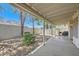Covered patio with desert landscaping, gravel, a privacy wall, and view of the mountains in the distance at 735 Wolf Point St, Henderson, NV 89002