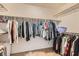 Walk-in closet with multiple shelves and rods for organized storage at 735 Wolf Point St, Henderson, NV 89002