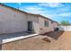 View of home's exterior, featuring a patio and gravel side yard at 7820 Milkweed Ct, Las Vegas, NV 89149