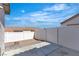 Enclosed backyard features a concrete patio and gravel landscaping, perfect for outdoor living at 7820 Milkweed Ct, Las Vegas, NV 89149
