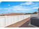 Fenced backyard with gravel, providing privacy and a clean outdoor space at 7820 Milkweed Ct, Las Vegas, NV 89149