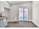 Eat-in kitchen area featuring stainless steel dishwasher and a glass sliding door to the backyard at 7820 Milkweed Ct, Las Vegas, NV 89149