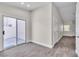 Open floor plan with sliding glass door to patio and entry doors to other rooms at 7820 Milkweed Ct, Las Vegas, NV 89149