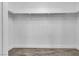 Empty walk-in closet with a clothing rack and wood-look flooring at 7820 Milkweed Ct, Las Vegas, NV 89149