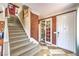 Grand entryway with staircase, checkered tile and views to the living area at 7959 Palace Monaco Ave, Las Vegas, NV 89117