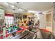 Home gym with various equipment, including weights, machines, and workout area at 7959 Palace Monaco Ave, Las Vegas, NV 89117