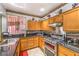 Well-equipped kitchen featuring stainless steel appliances, granite countertops, and plentiful cabinet storage at 7959 Palace Monaco Ave, Las Vegas, NV 89117