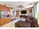 Inviting living room featuring tile floors, a ceiling fan, plush seating, and stylish decor at 7959 Palace Monaco Ave, Las Vegas, NV 89117