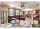 Spacious living room featuring tile floors, a ceiling fan, ample seating, and an open floorplan at 7959 Palace Monaco Ave, Las Vegas, NV 89117