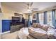 Relaxing living room with large sectional couch, media center, and natural light at 7959 Palace Monaco Ave, Las Vegas, NV 89117