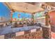 An outdoor bar with black marble countertops and custom decor provides a unique entertainment space at 7959 Palace Monaco Ave, Las Vegas, NV 89117