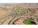 Wide aerial shot showcasing community, golf course, and surrounding desert mountains at 8 Via Dolcetto, Henderson, NV 89011